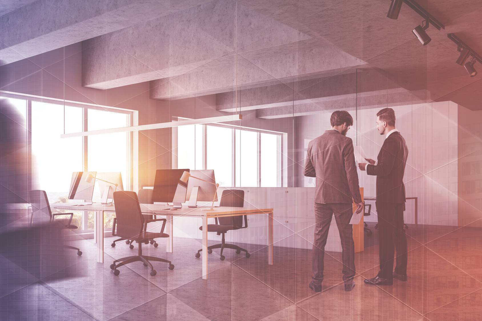 Business people discussing documents in industrial style office with white walls, concrete ceiling and row of white computer desks and file cabinets. Toned image double exposure blurred